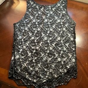 Stunning sequined HOLIDAY top. Black and Baby Blue/Grey, zips up back. Slinky,